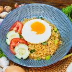 A plate of Nasi Goreng Eyang with a fried egg