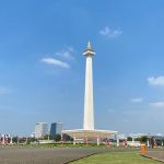 The National Monument of Indonesia against a blue sky