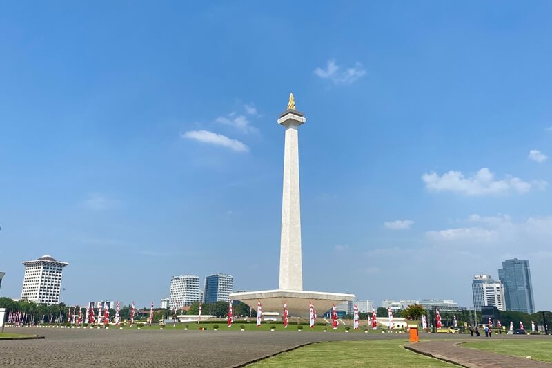 The National Monument of Indonesia against a blue sky