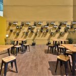 Outdoor seating area at a hotel with tables and chairs