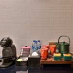 A set of hotel room amenities on a white tray