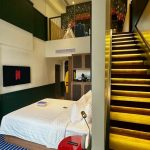 Modern hotel room11 with a bed and large window