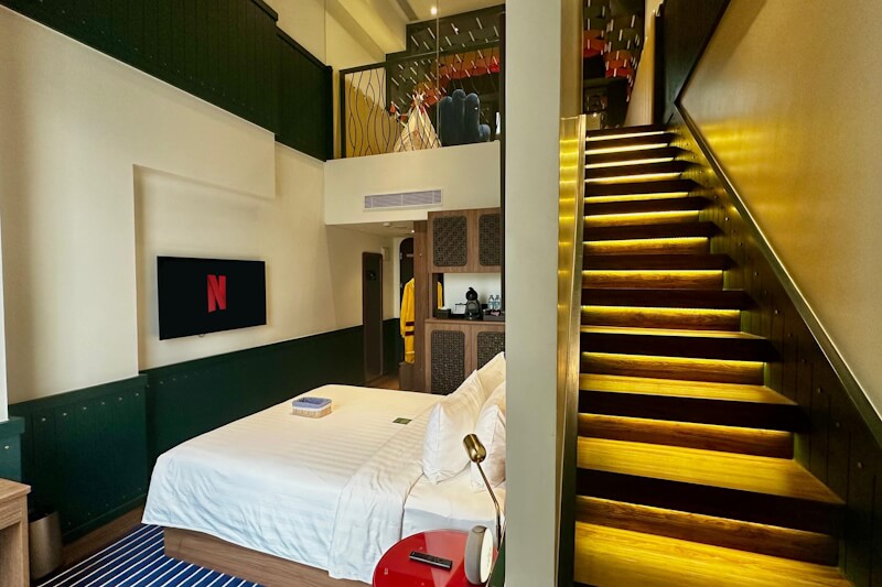 Modern hotel room11 with a bed and large window