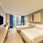 Bright modern hotel room3 with a large window