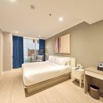 Modern hotel bedroom, Room 5, with a city view