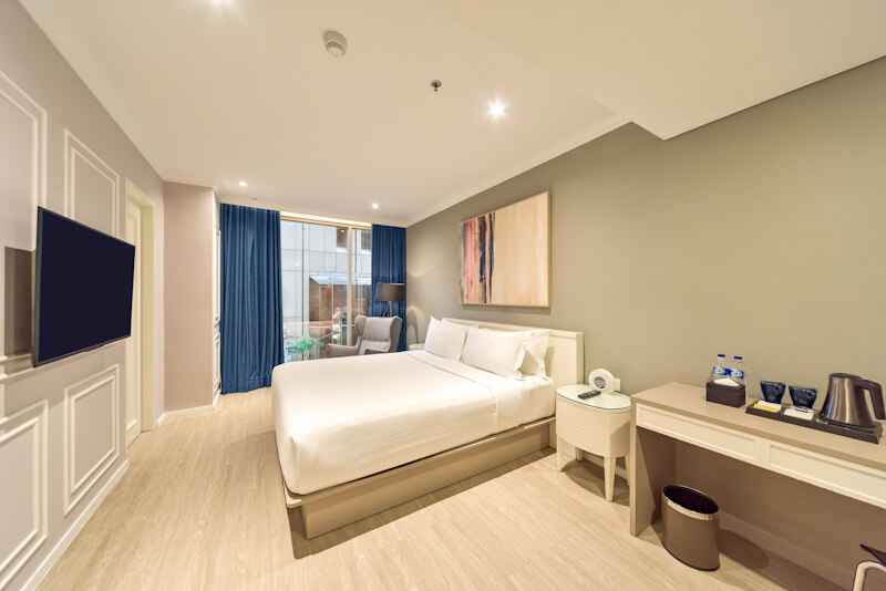Modern hotel bedroom, Room 5, with a city view