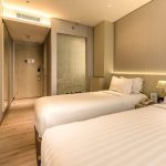 A bright and modern hotel bedroom, Room 6