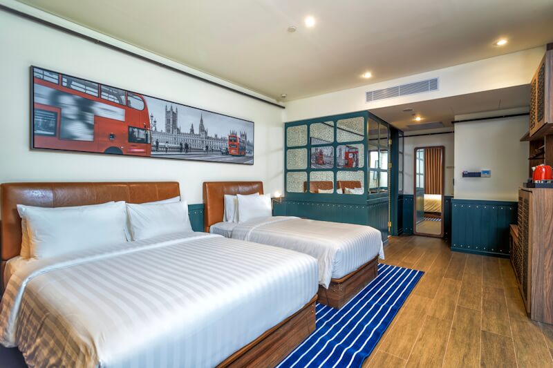 Modern hotel room 7 with a large bed and window