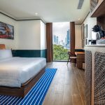 A modern hotel bedroom, room8