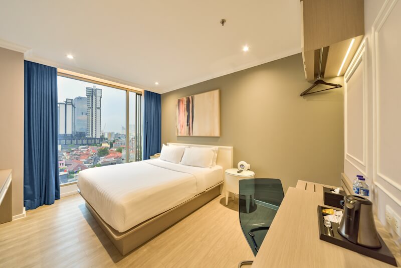 Bright hotel bedroom, Room 8, with minimalist decor