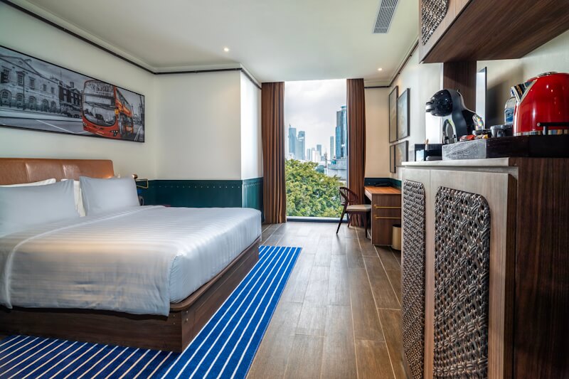 A modern hotel bedroom, room8