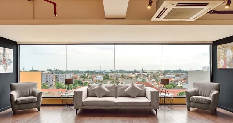 A modern seating area with two armchairs and a side table
