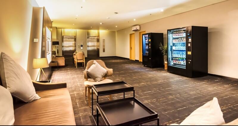A modern hotel lounge with a cozy seating area