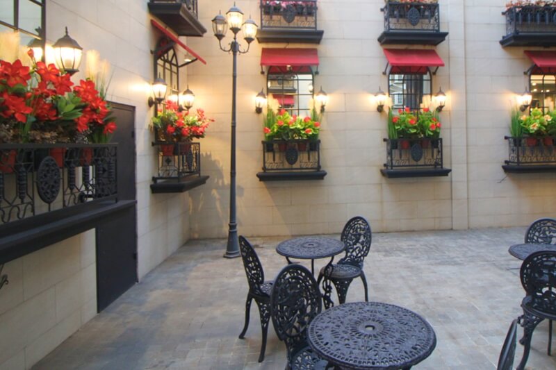 Outdoor dining at the Secret Garden with string lights