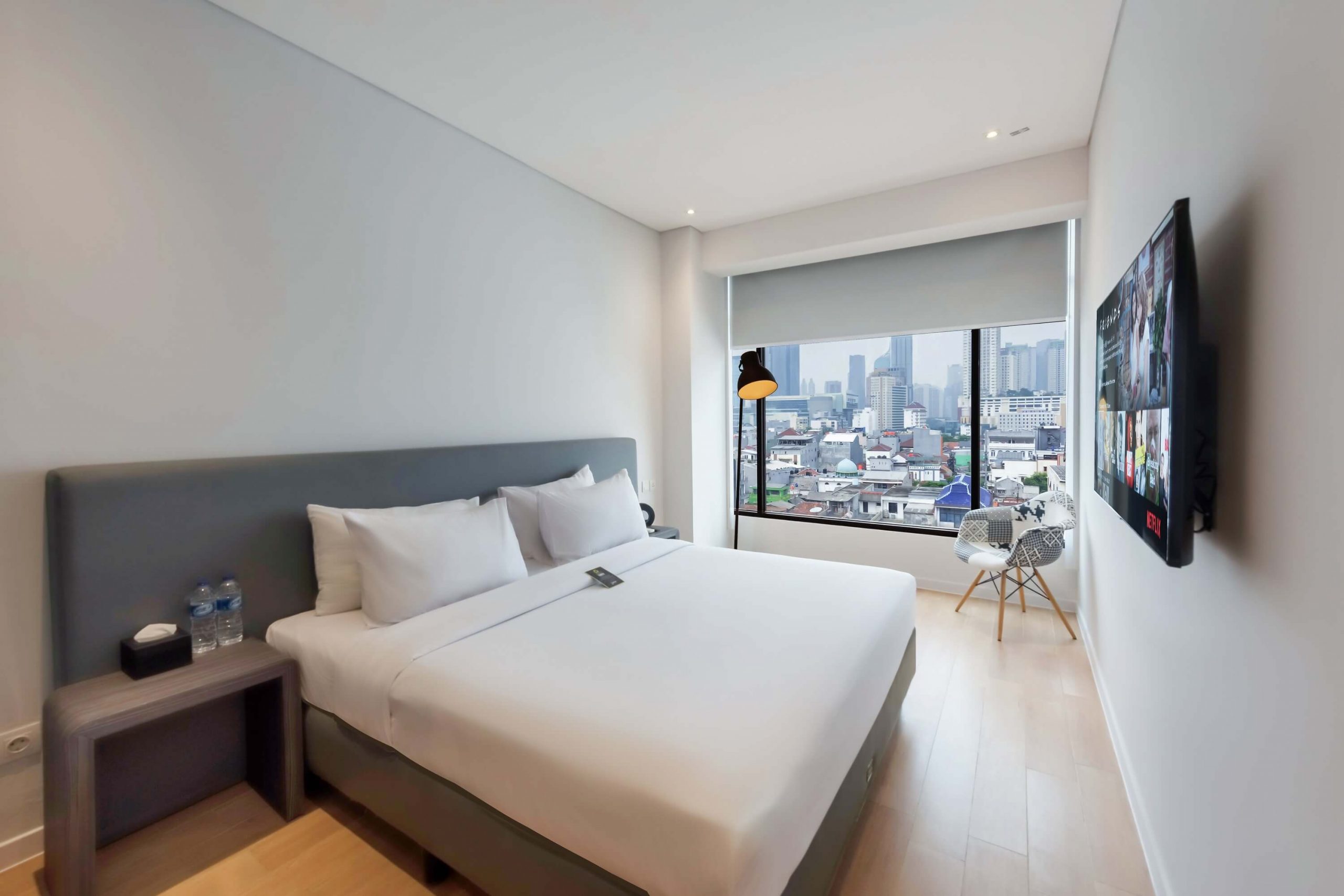 Modern skyline room with a large window overlooking the city