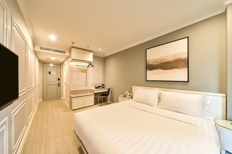 A modern superior double hotel room with a large bed
