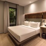 Modern Superior Queen hotel room with a large bed