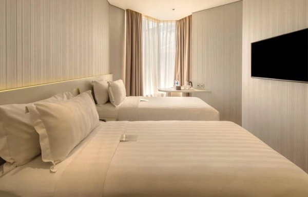 A clean superior twin room with two beds
