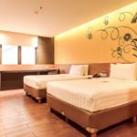 A modern Superior Twin hotel room with two single beds