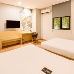 A superior twin hotel room with two beds