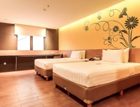 A modern Superior Twin hotel room with two single beds