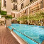 Rooftop swimming pool with a city skyline view
