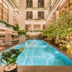 Hotel swimming pool with sun loungers