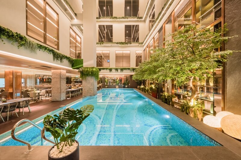 Hotel swimming pool with sun loungers