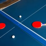 Hotel game room with a blue table tennis table