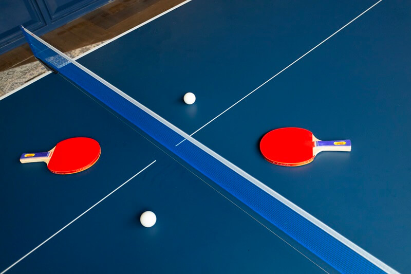 Hotel game room with a blue table tennis table