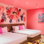 A modern thematic hotel room with a king-sized bed