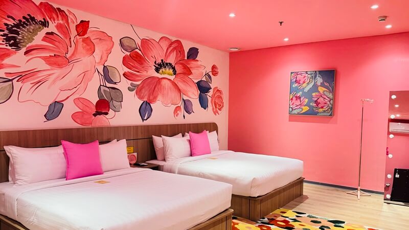 A modern thematic hotel room with a king-sized bed