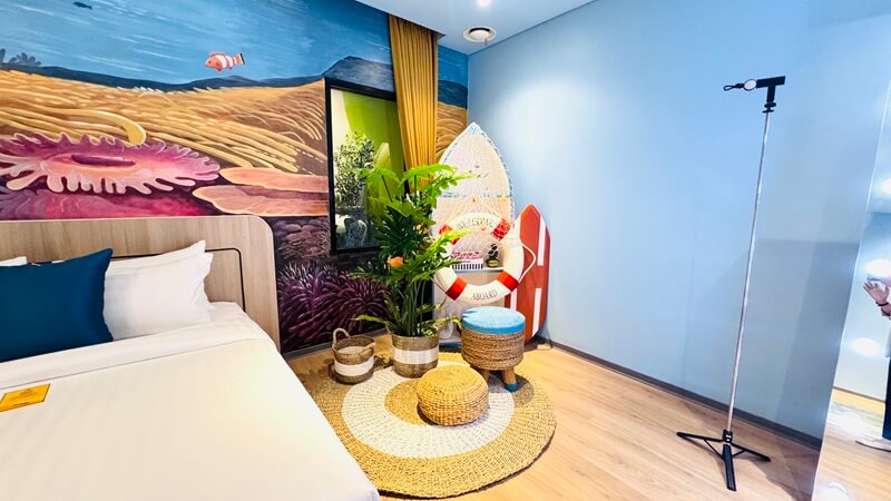 A modern thematic hotel room with a large bed