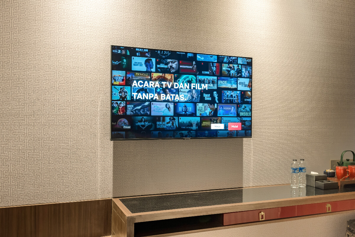 Flat-screen TV in a modern Ashley Tang hotel room