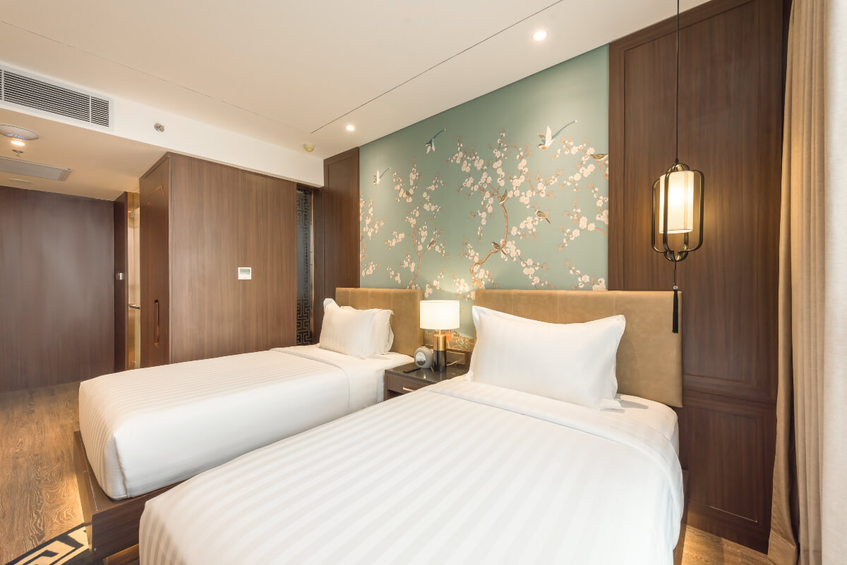 Modern twin bedroom at Ashley Hotel Group