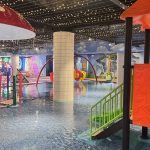 Colorful water park with slides and a large pool