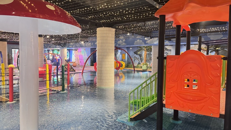 Colorful water park with slides and a large pool