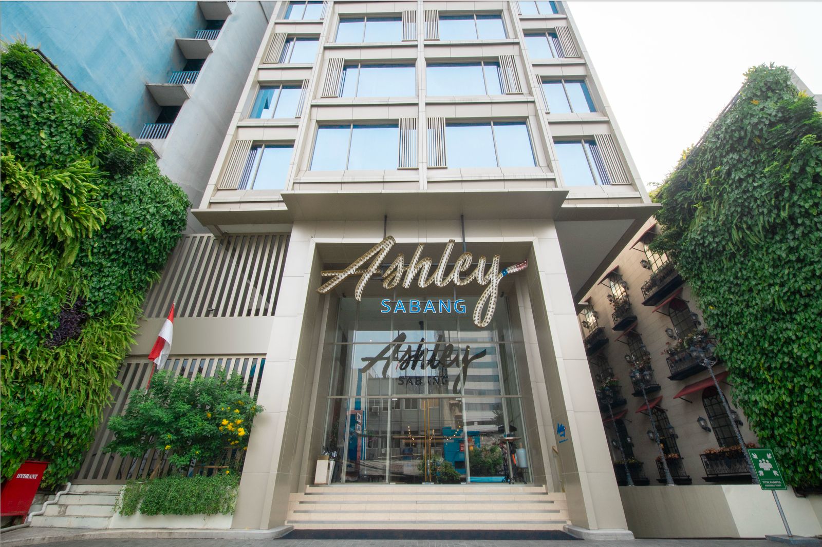 The front entrance and sign of Ashley Sabang hotel