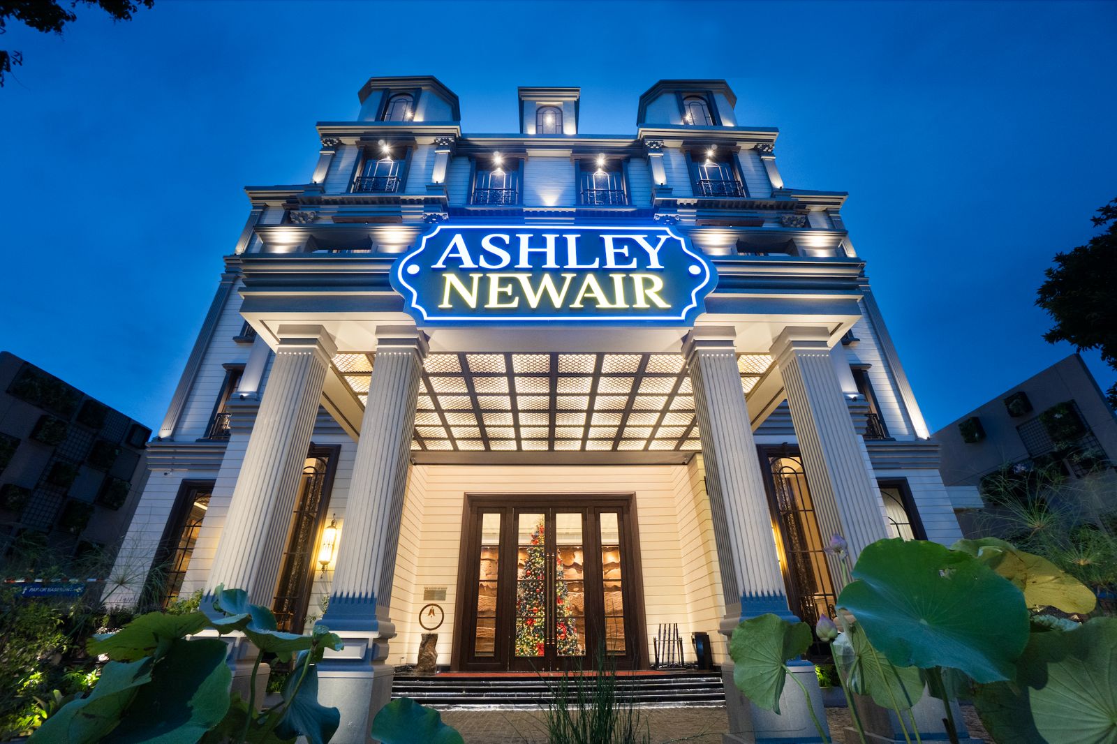 Grand hotel entrance with Ashley Newair logo