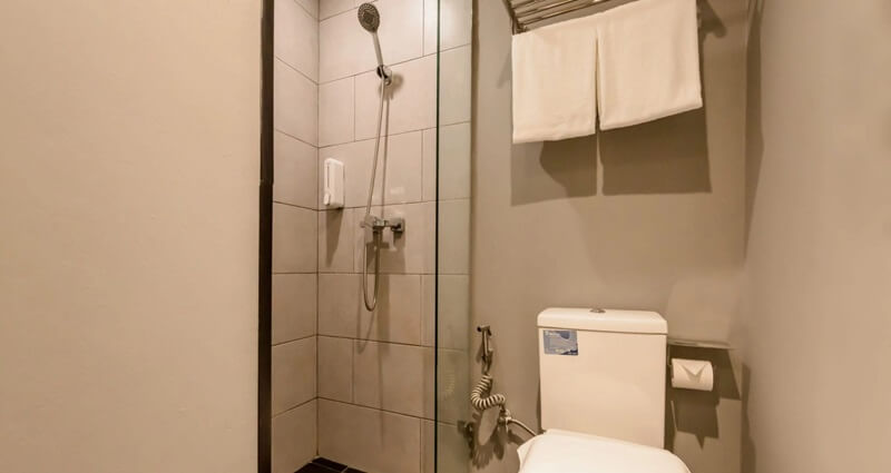 A modern YBTA bathroom with a backlit mirror