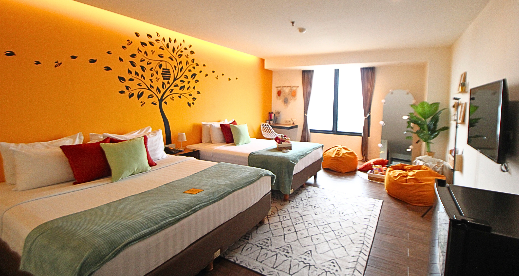 Yellow and white bunk bed room at Yellow Bee Tangerang