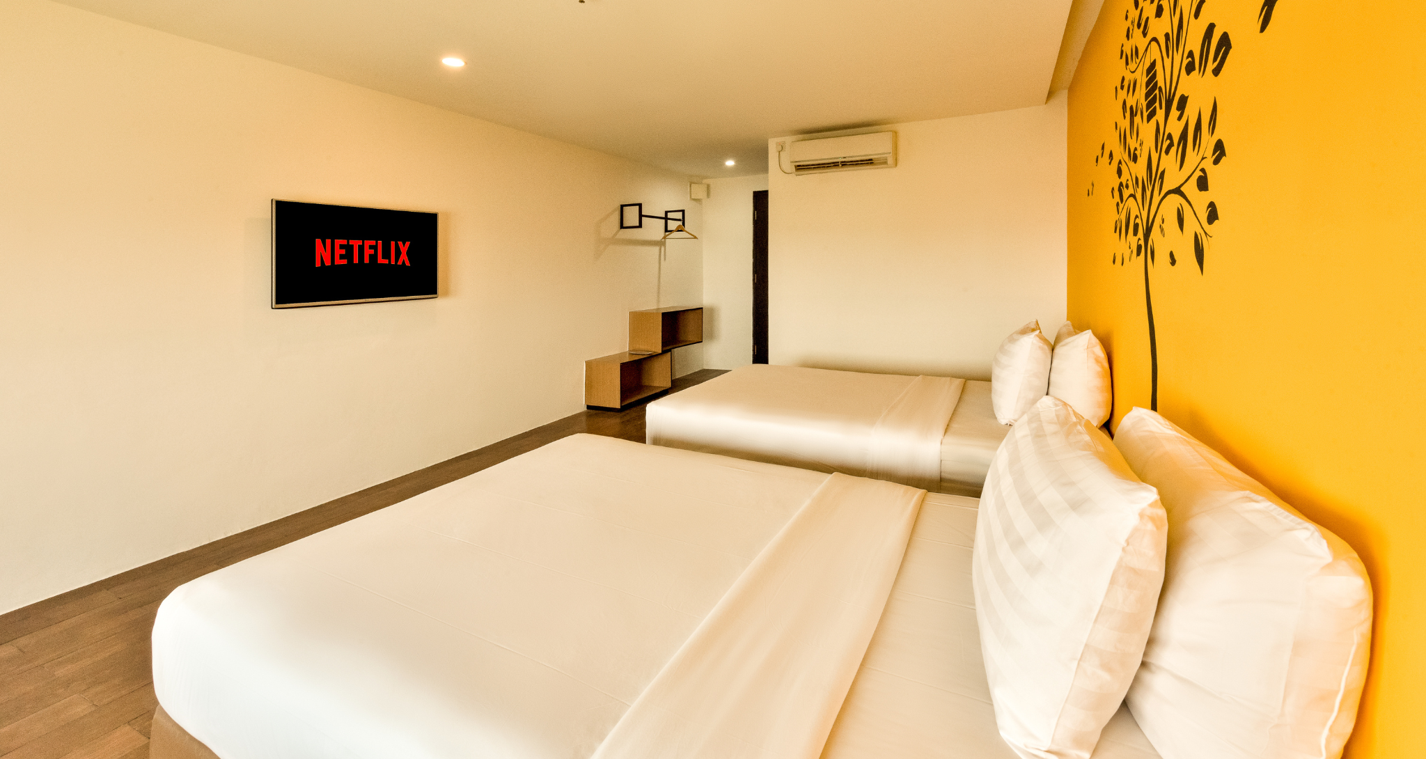 Ashley Hotel Group twin bedroom with a city view