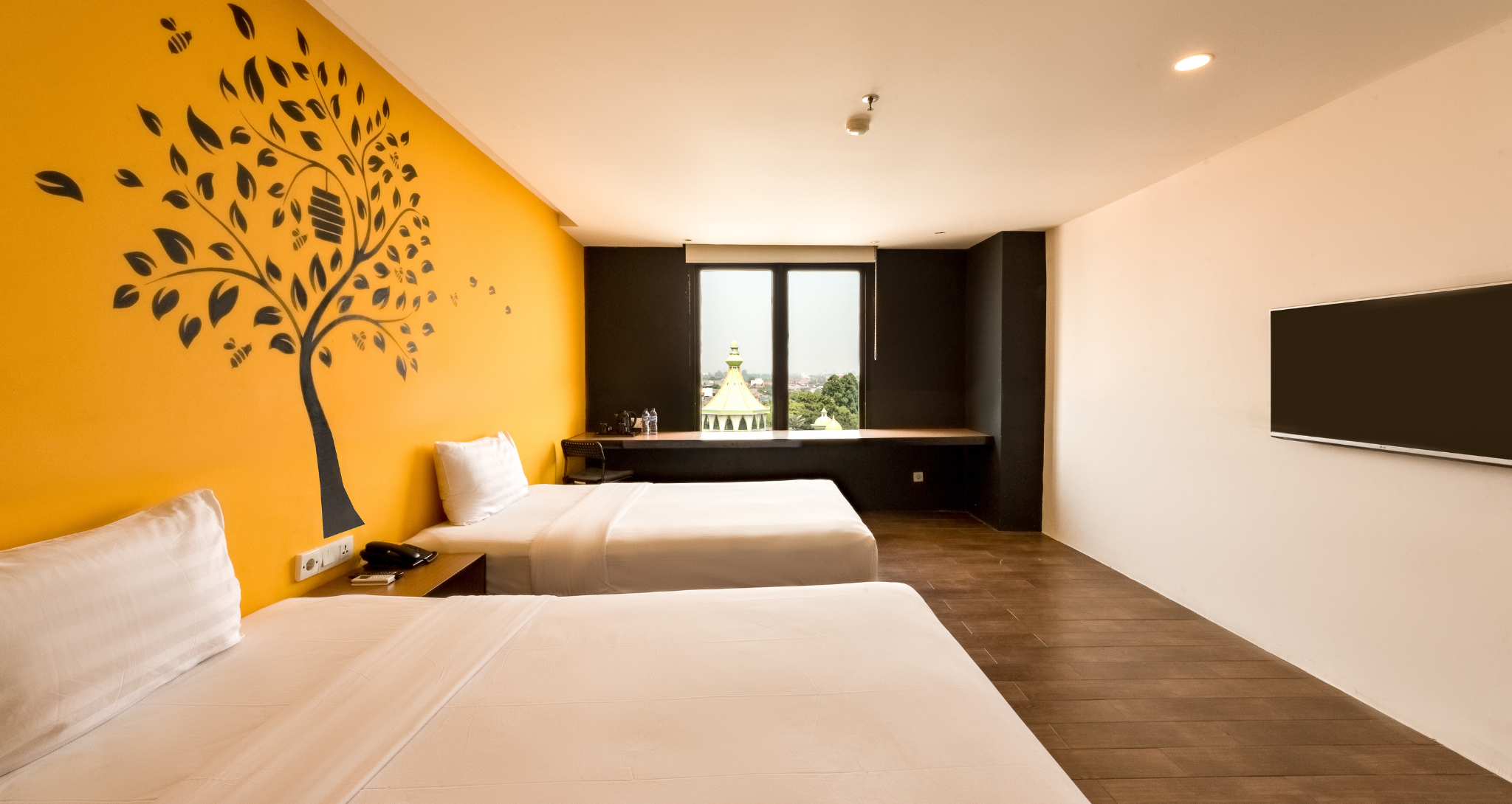 Modern twin bedroom at Ashley Hotel Group
