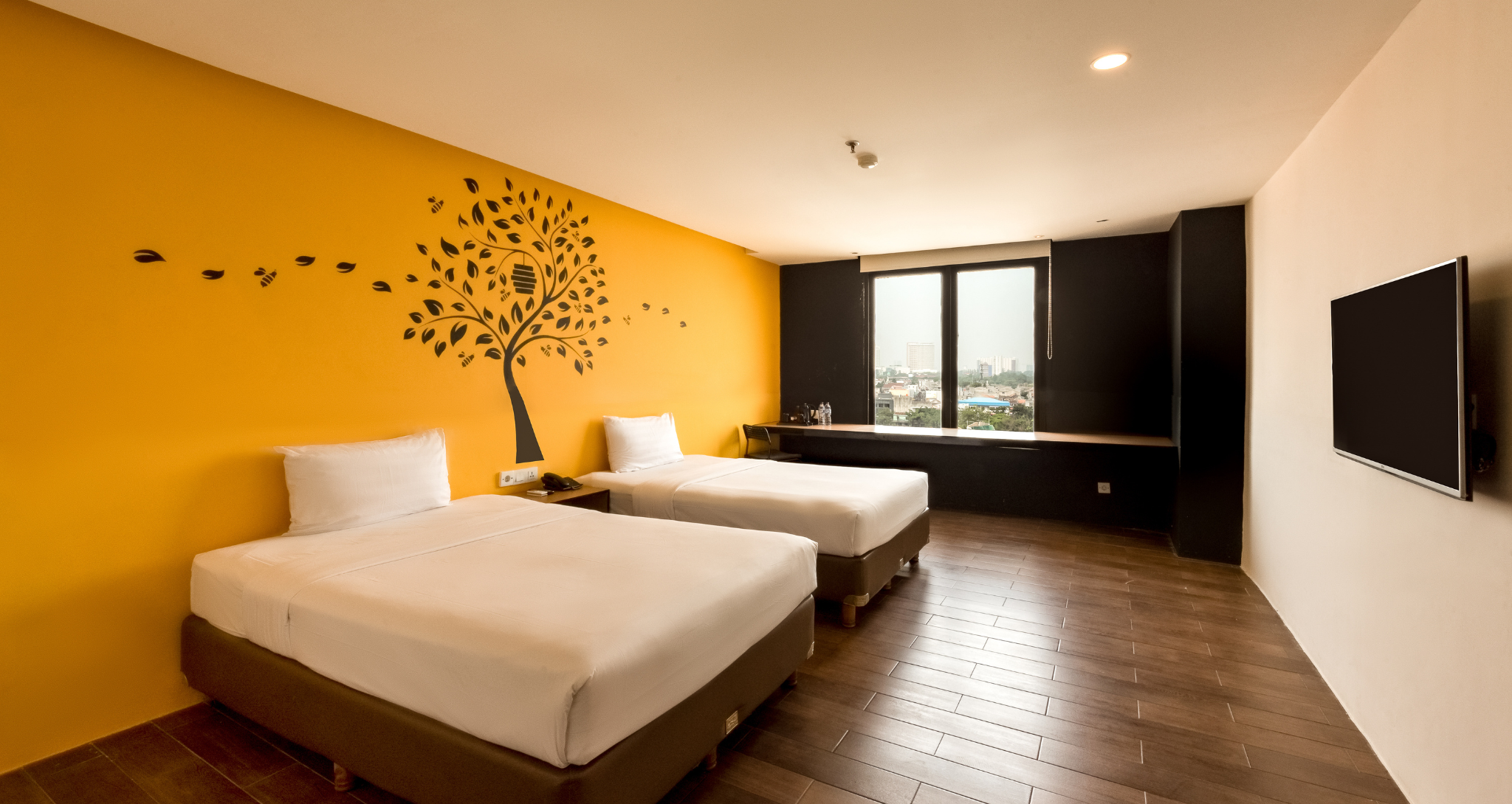 Modern deluxe twin room at an Ashley Hotel Group hotel