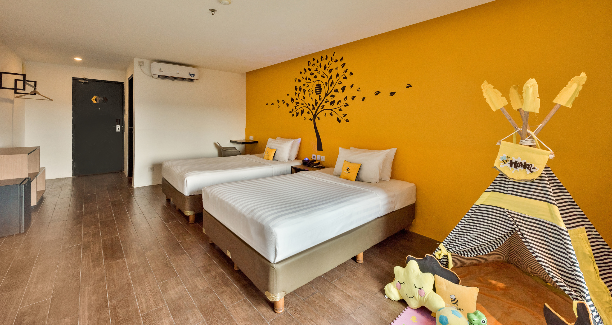 Ashley Hotel Group modern family room with two beds