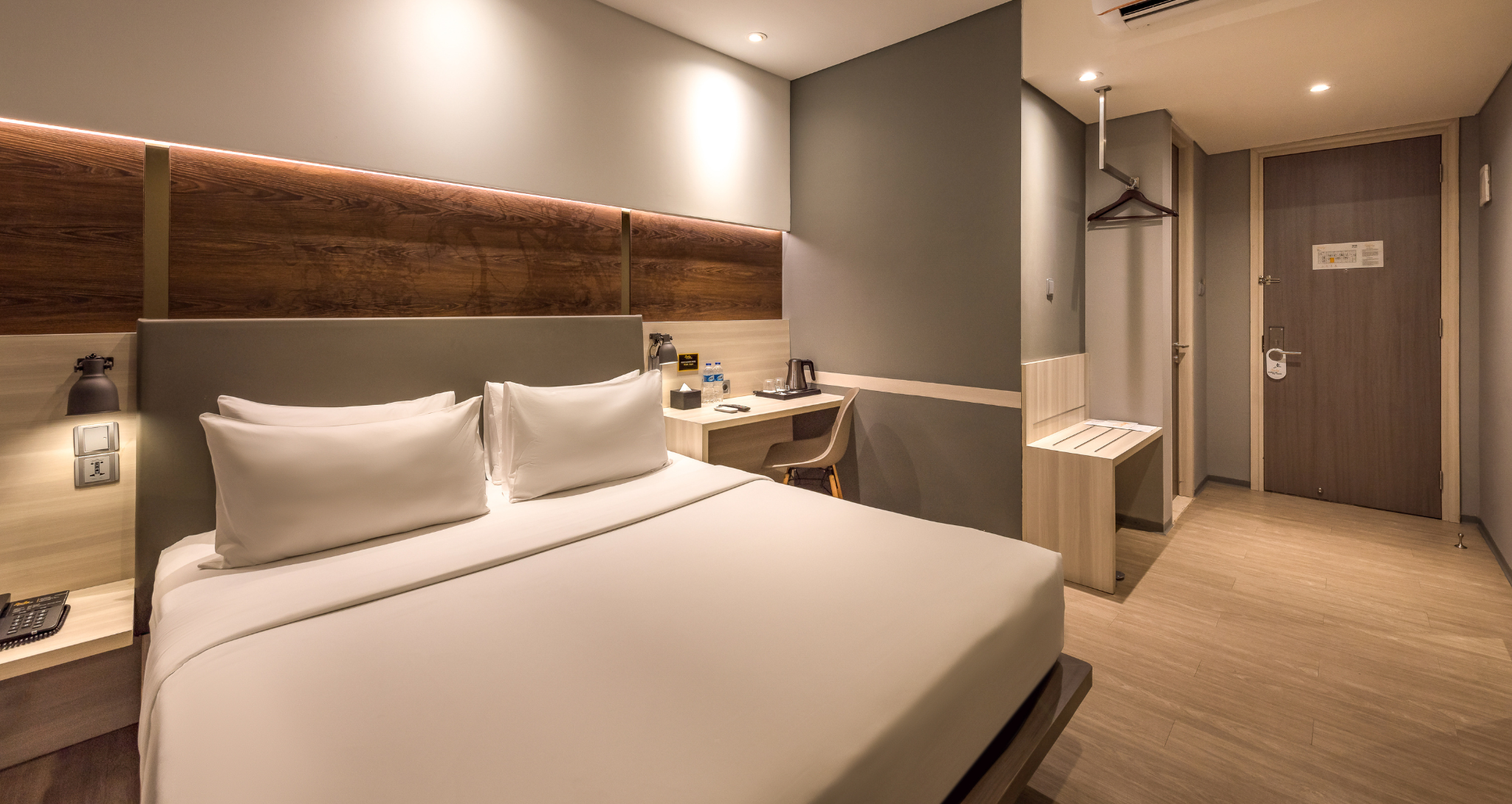 Modern Ashley Hotel Group bedroom with a large window