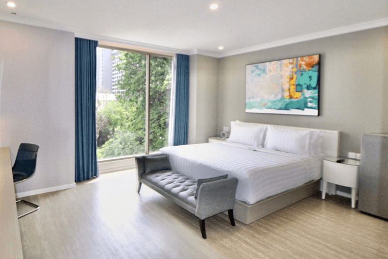 A modern Ashley Room with a large bed and window