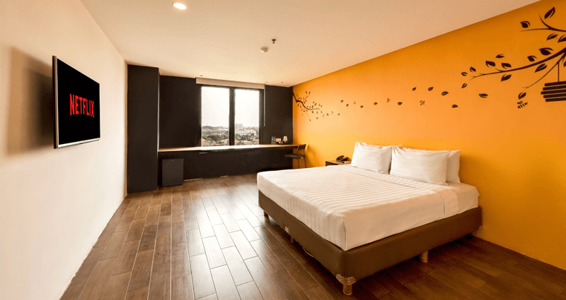 Executive double room with two beds and a city view