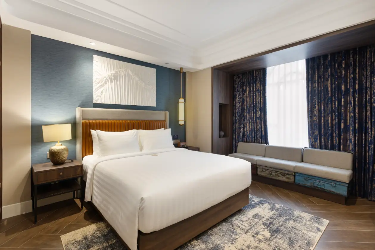 New Air Deluxe Queen hotel room with blue decor