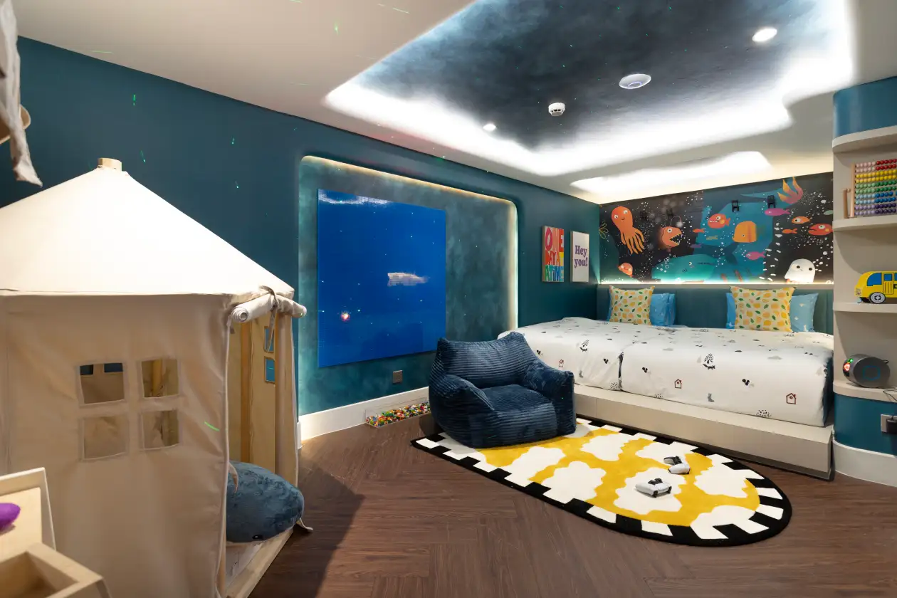 Modern family duplex room with ocean theme and play tent